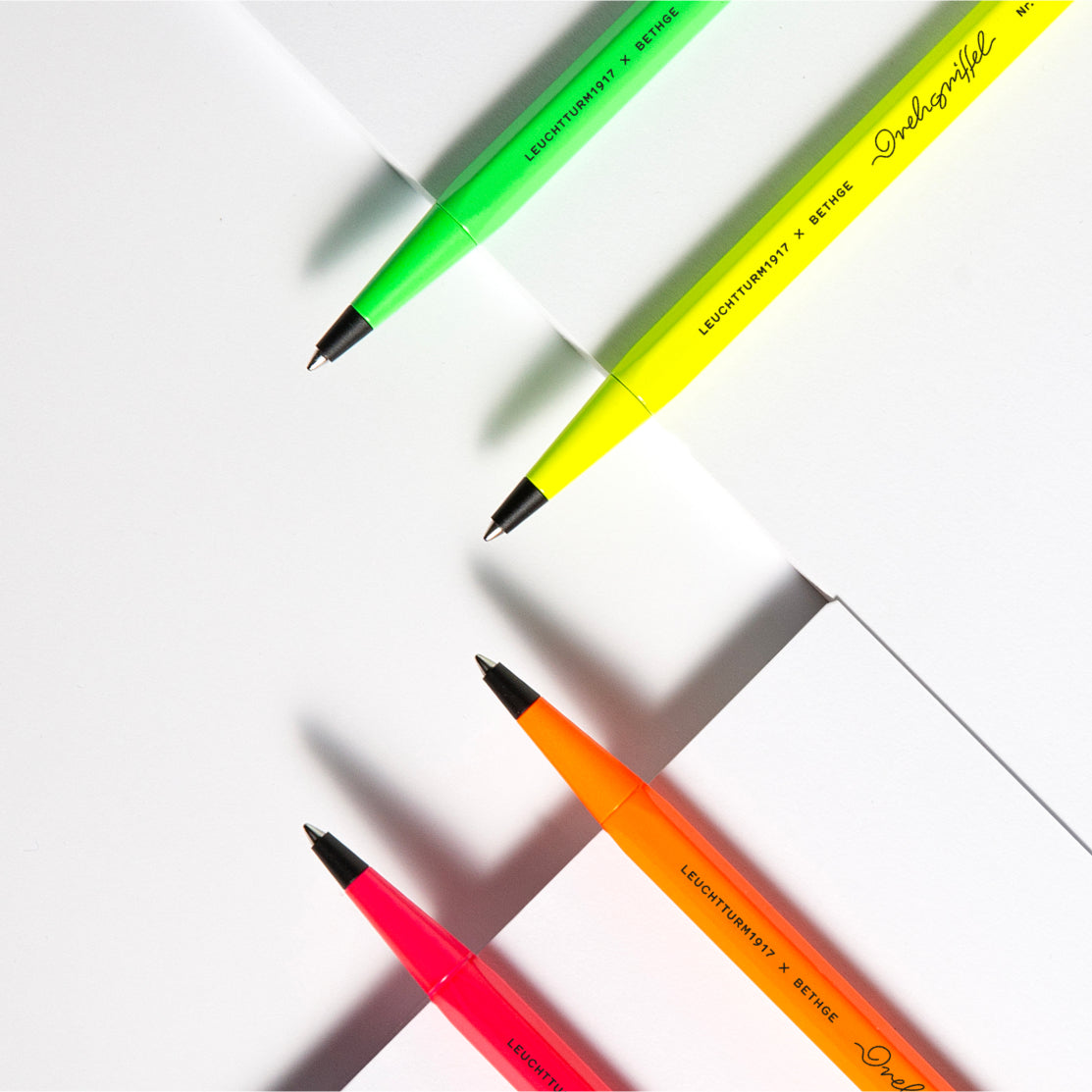 Leuchtturm1917 × Bethge Drehgriffel Nr. 1 Luminous Edition Ballpoint Pen in neon colors with black accents.