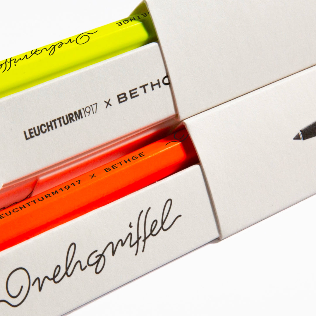 Leuchtturm1917 × Bethge Drehgriffel Nr. 1 Luminous Edition Ballpoint Pen in neon yellow and orange with black accents.